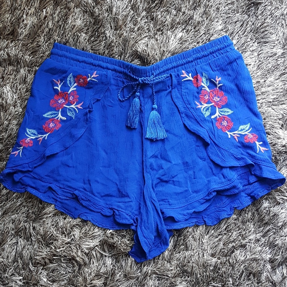 blue shorts with floral stitching